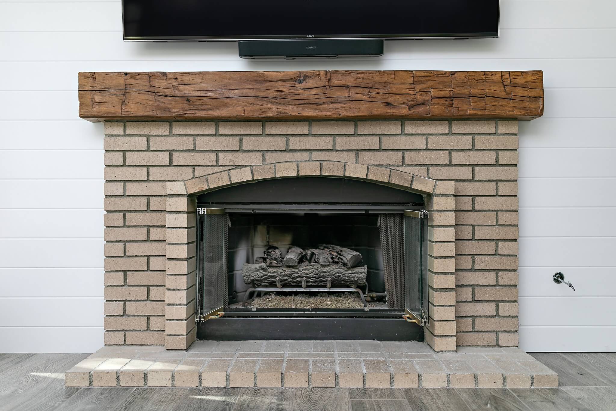 Wood-and-brick-fireplace-renovation
