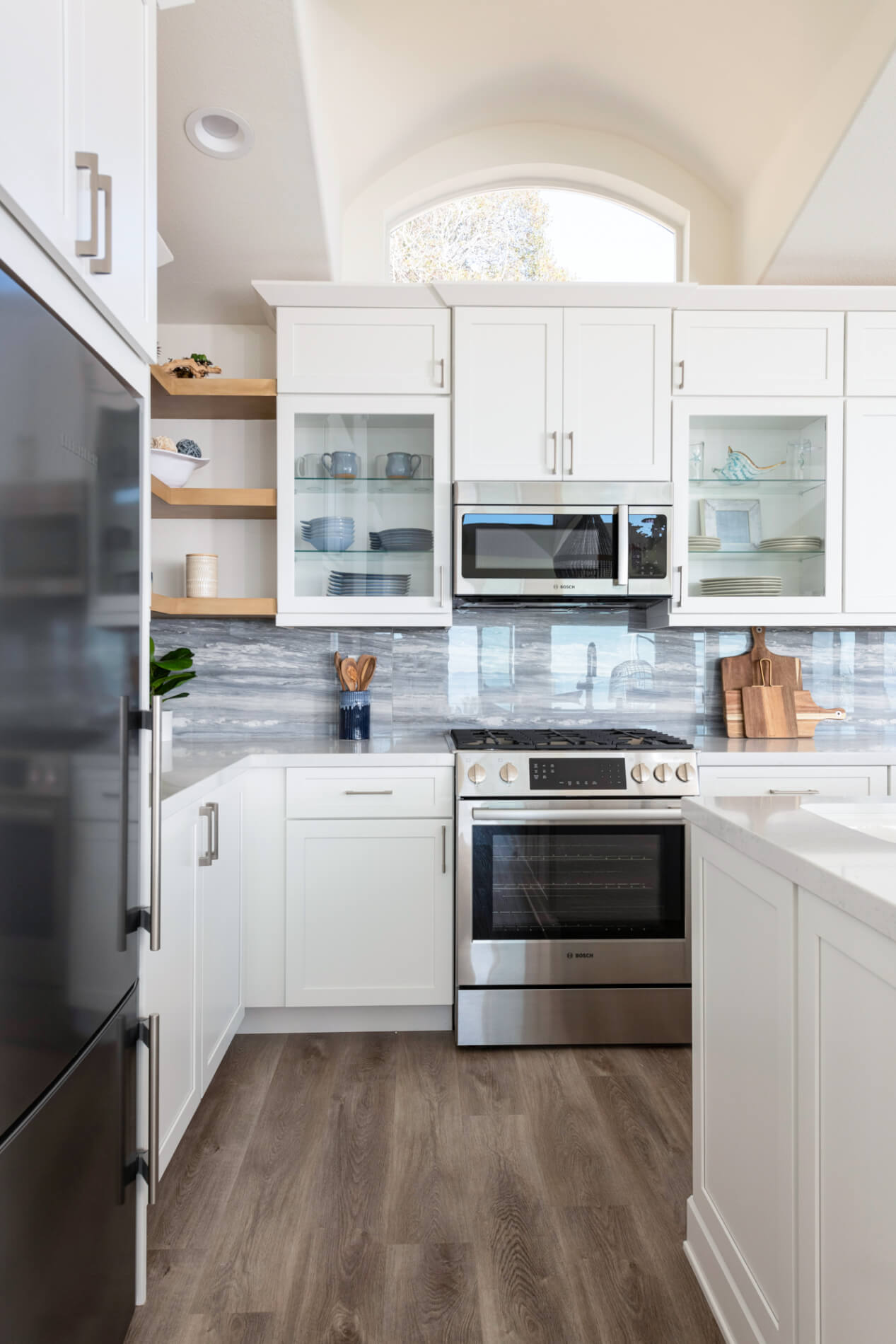 White-cabinetry-with-glossy-blue-porcelain-backsplash-in-Laguna-Beach-kitchen-renovation