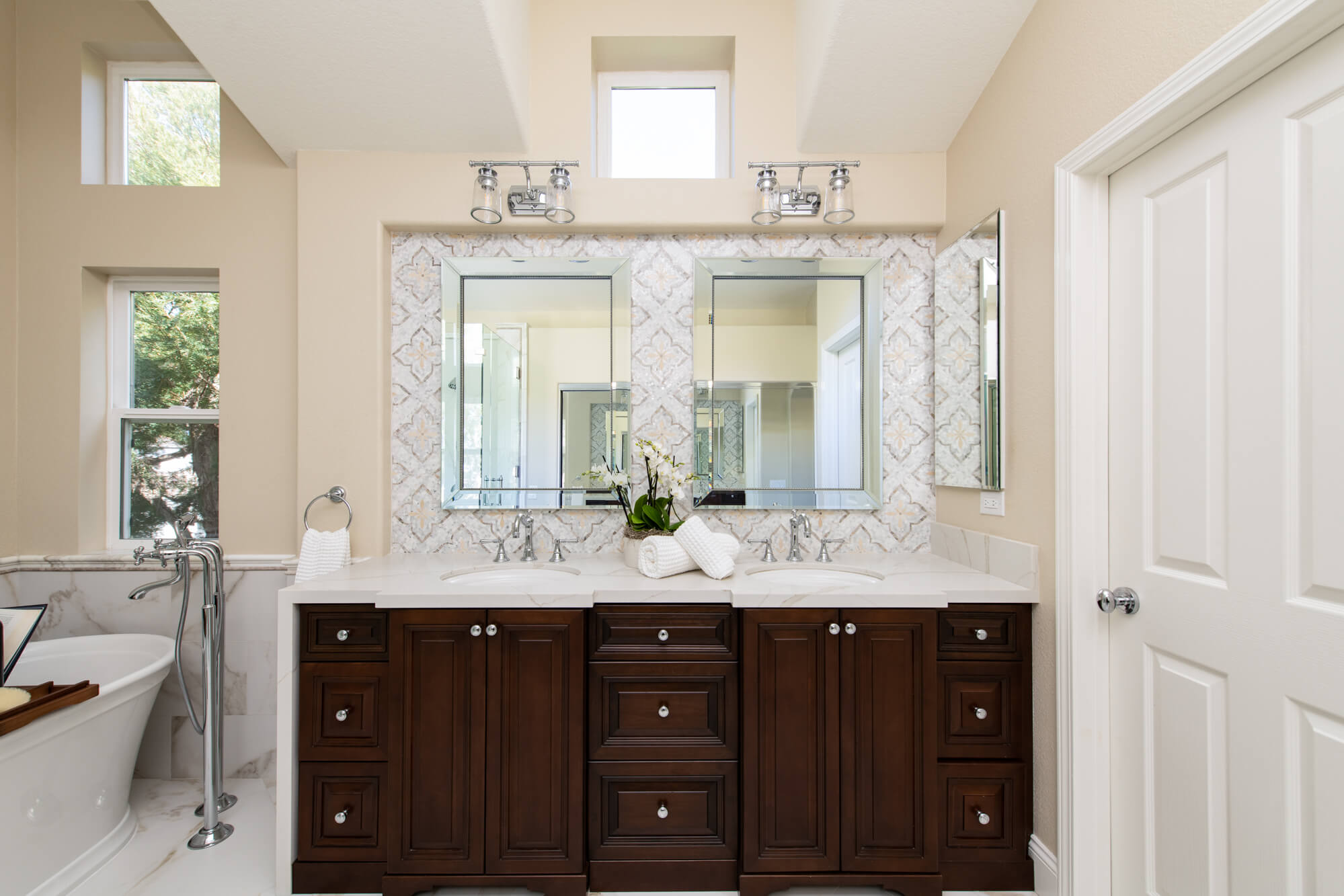 Dual-vanity-sinks-with-marble-mosaic-tile-backsplash