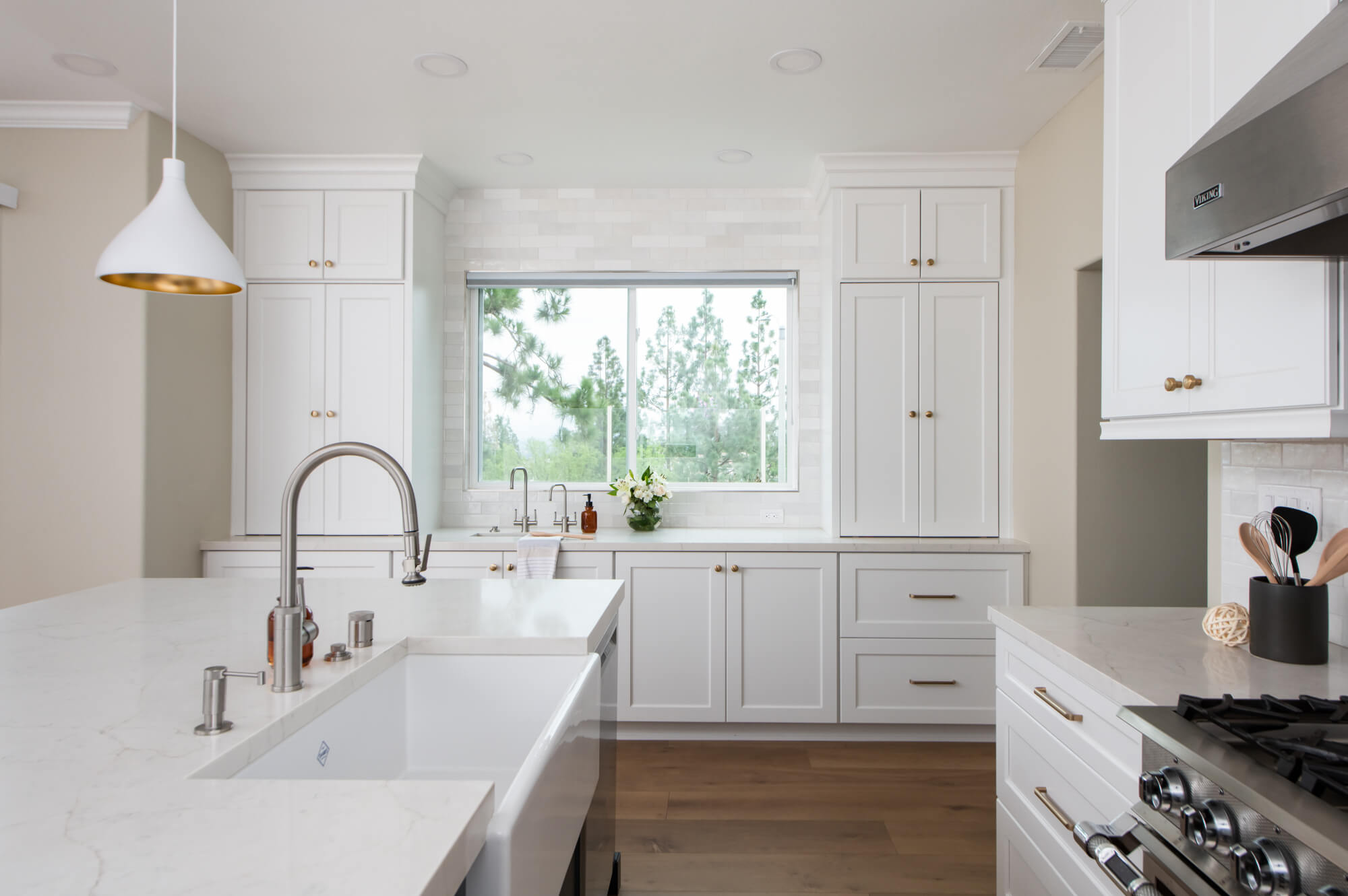 Farmhouse sink and white kitchen cabinets