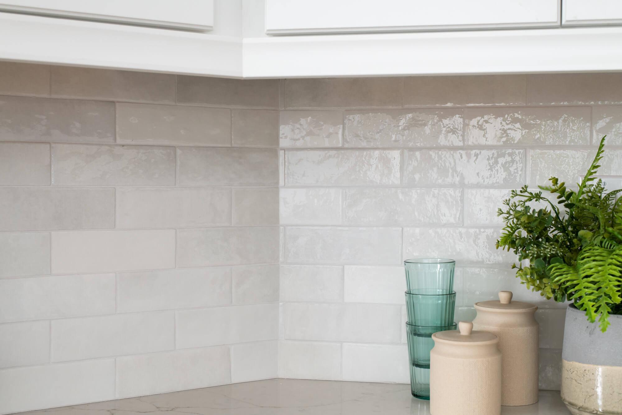 Ceramic Cloe white subway tile backsplash in kitchen remodel