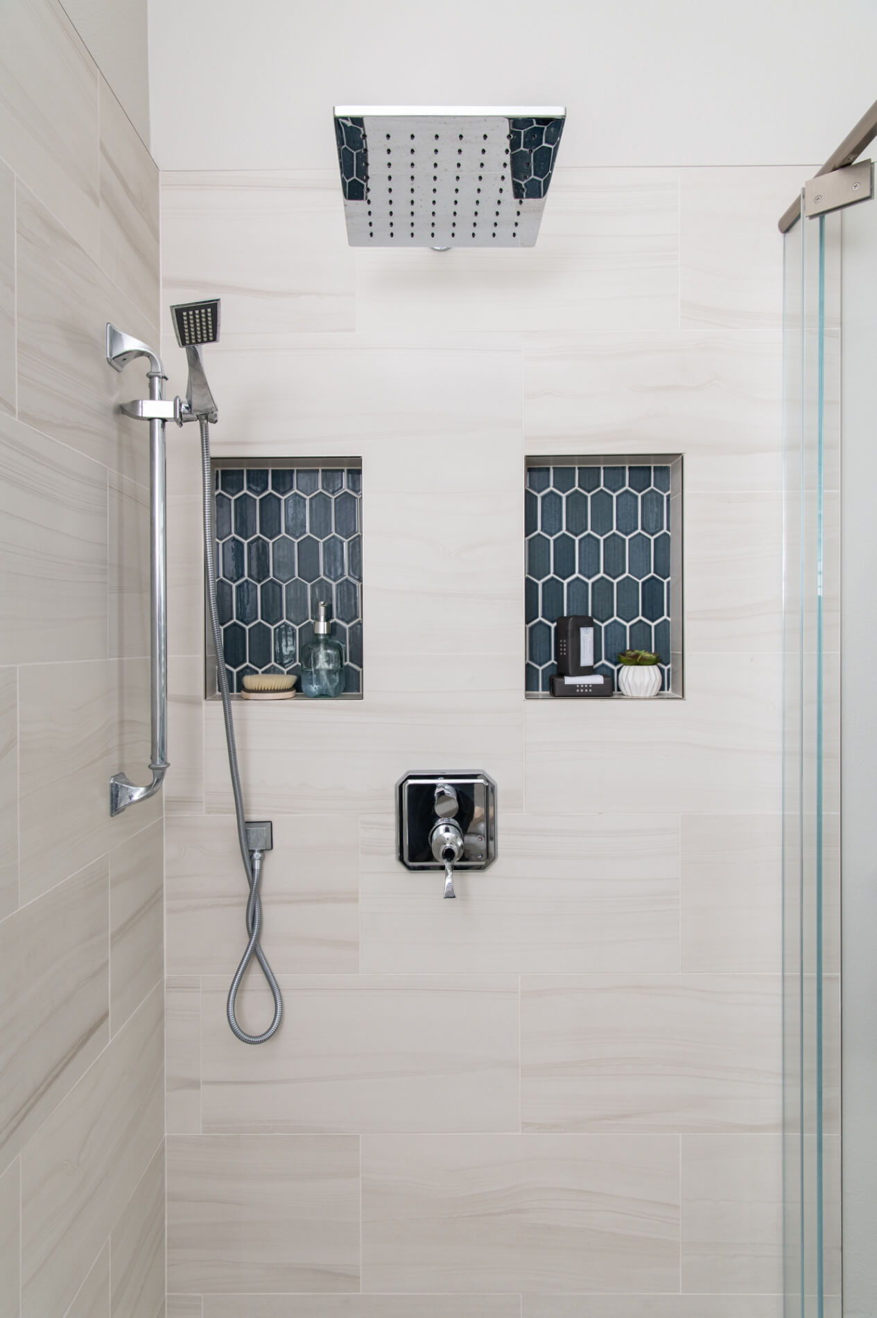 Glass-walk-in-shower-with-accent-in-remodel