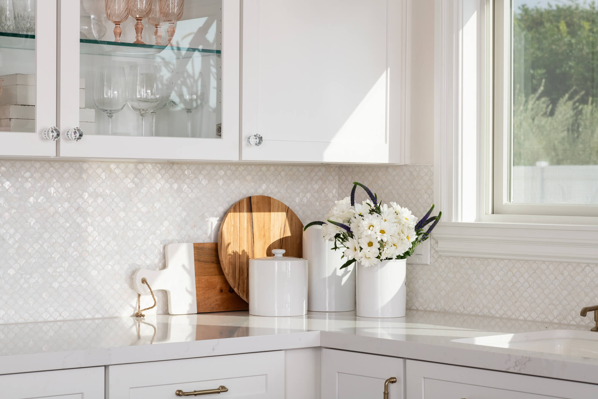 Quartz countertop and tile backsplash in Tustin kitchen remodel