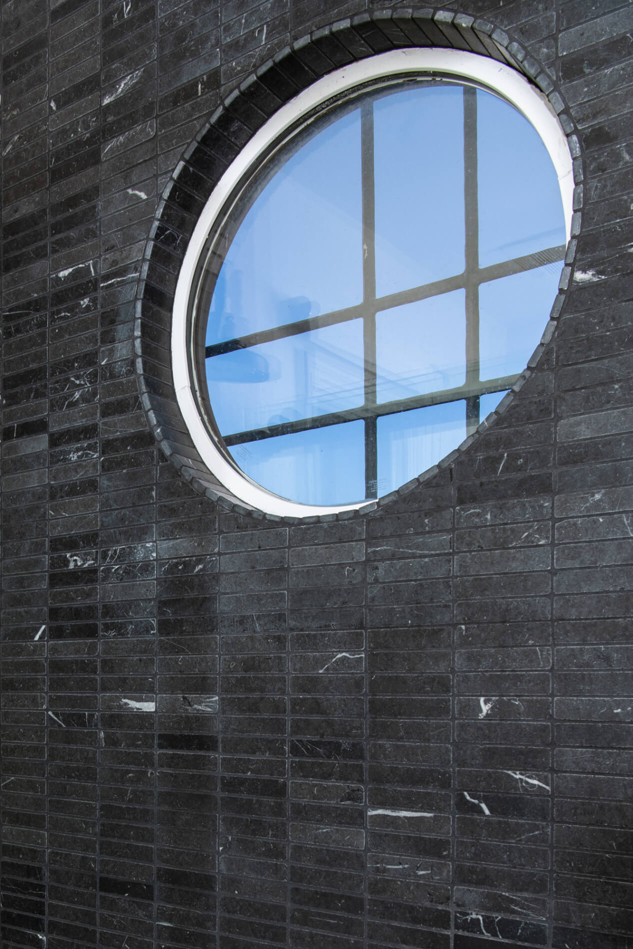 Black Marble accent wall tile in remodel