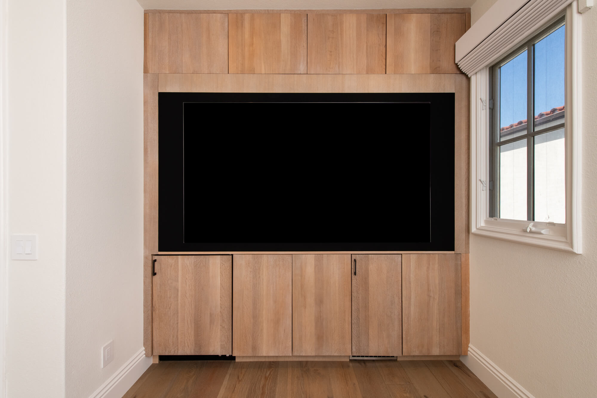 European oak herrinbone flooring and shelving vignette in WFH office remodel