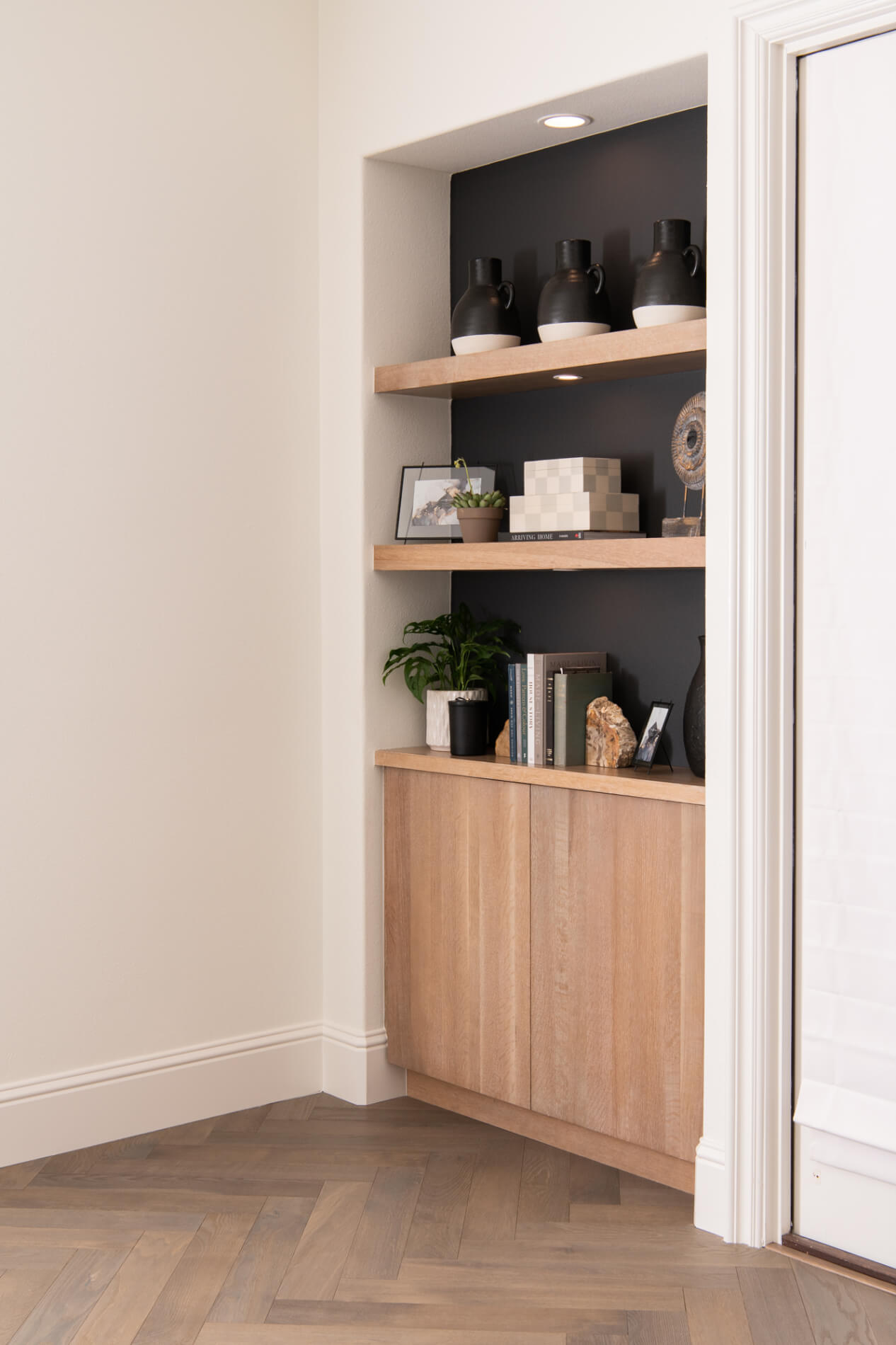European oak herrinbone flooring and shelving vignette in WFH office remodel