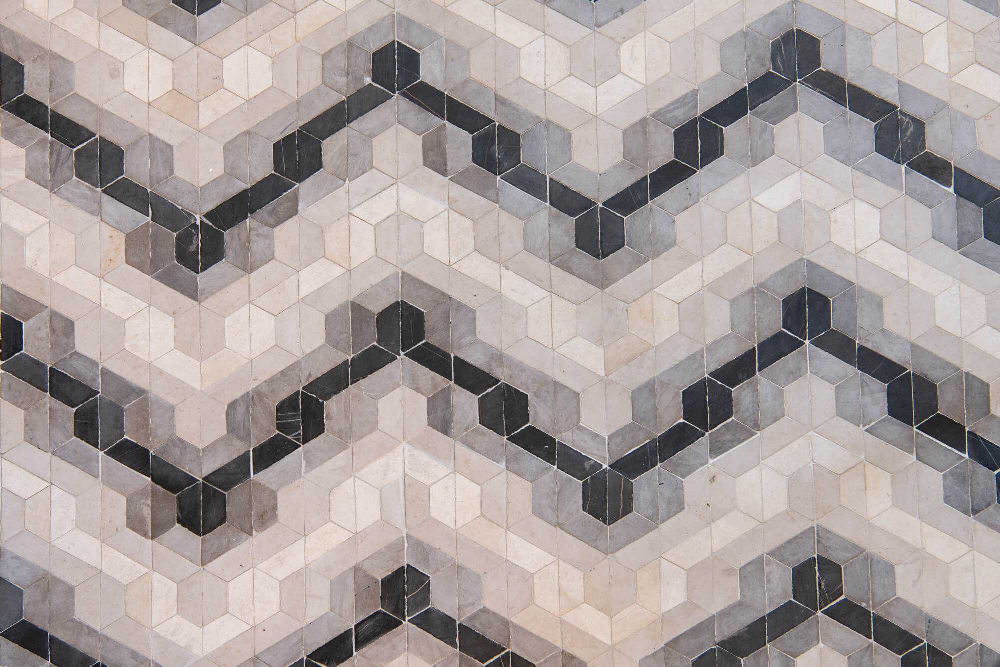 Limestone flooring tile with stunning geometric design in guest bathroom remodel