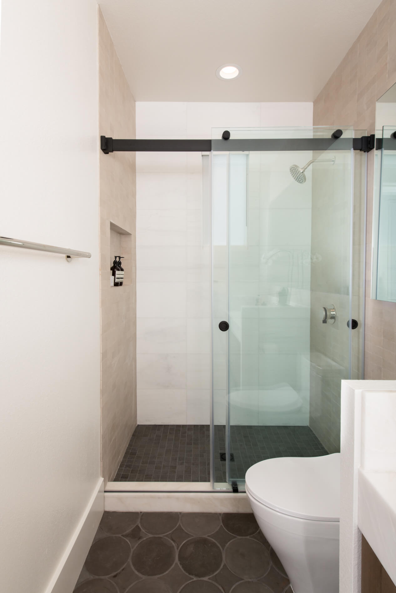 Terra-cotta bathroom floor tile in bath remodel