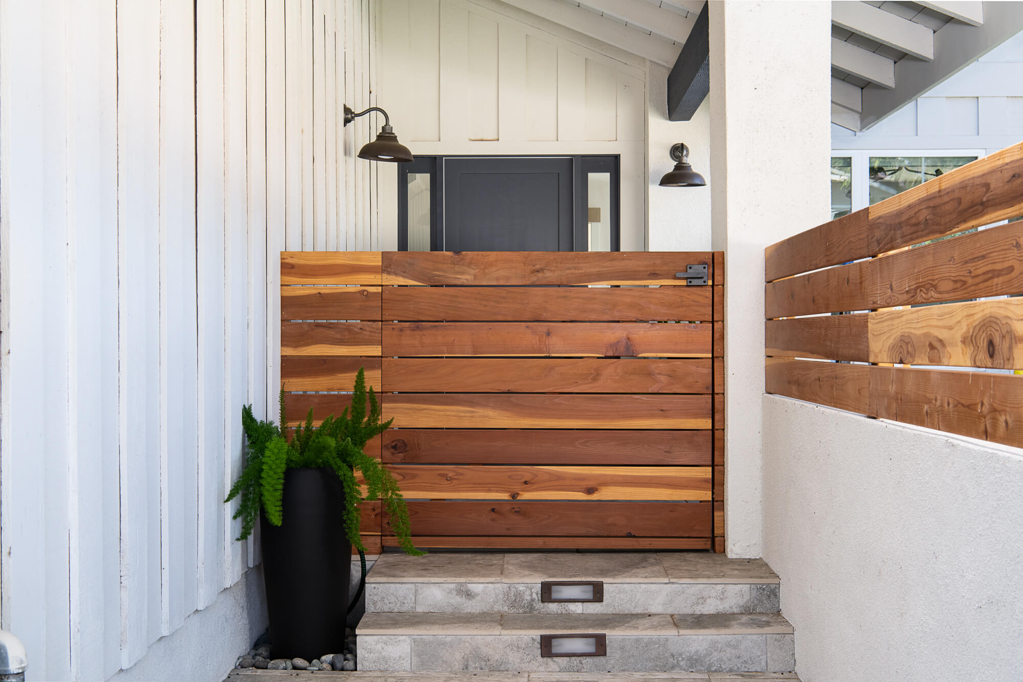 Custom front gate design in home remodel