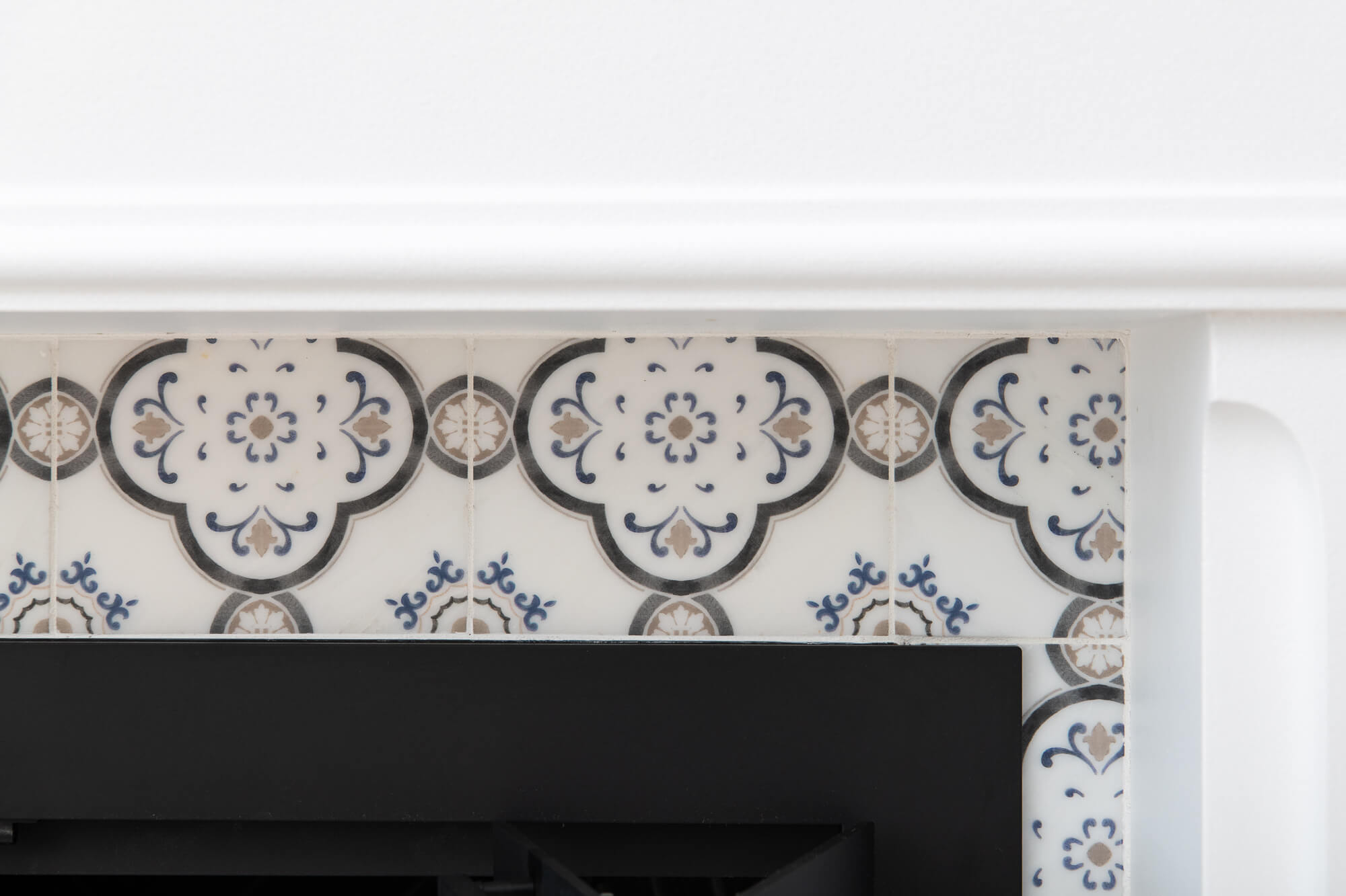 Carrera-marble-obsidian-fireplace-remodel