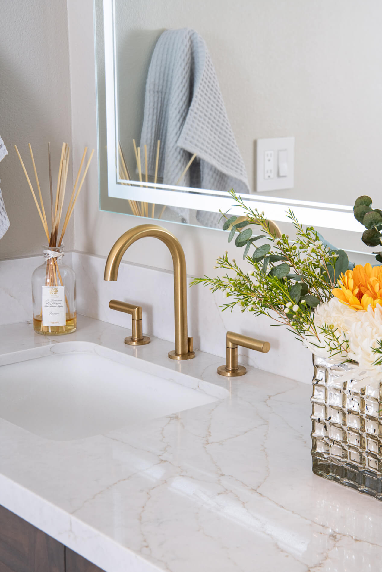 undermount-sink-with-wide-spread-satin-gold-faucet