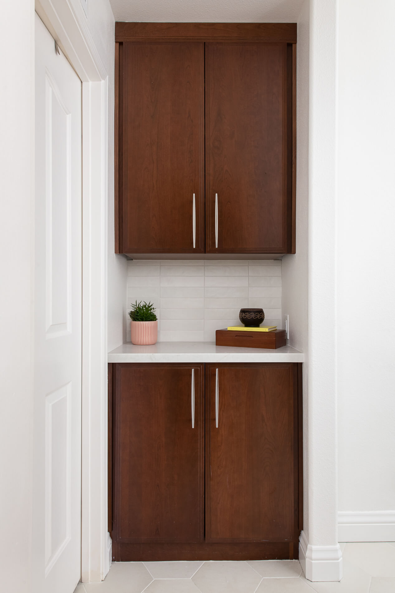 additional-storage-nook-omega-cabinets-polished-quartz-counters