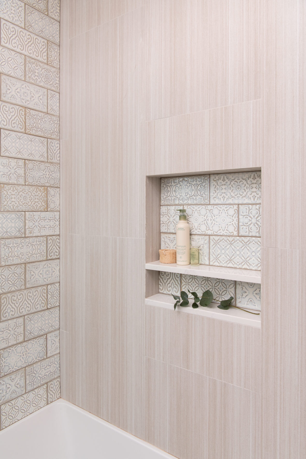 accent-wall-and-niche-with-random-mix-of-patterns-staggered-porcelain-tiles-in-Polished-patina