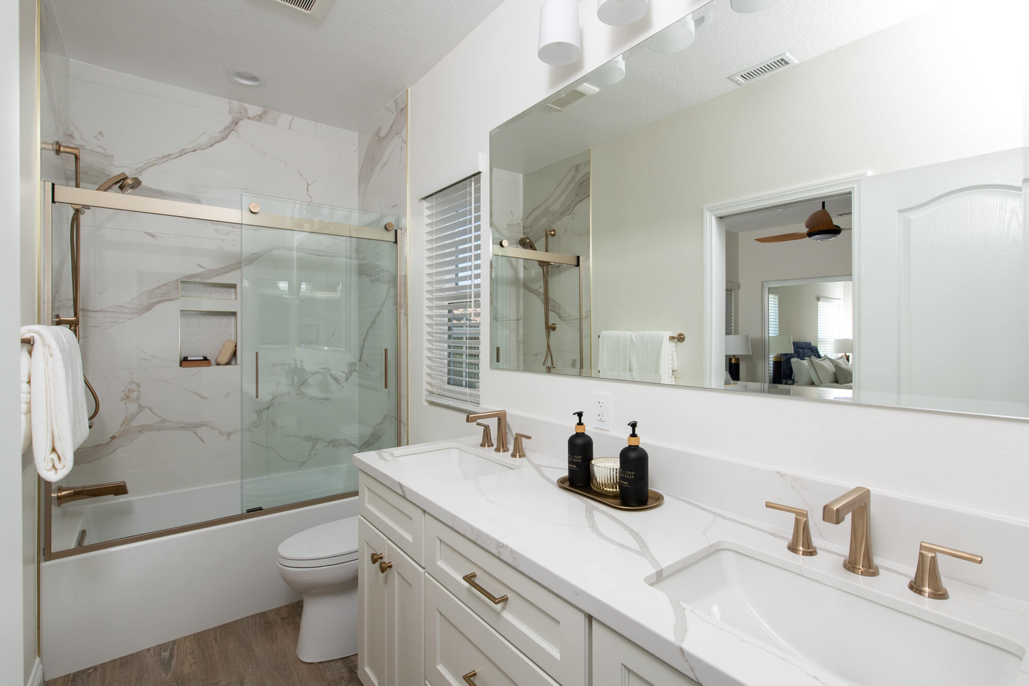 Large-Custom-Beveled-Vanity-Mirror-widespread-faucet-in-honey-bronze-sliding-glass-bath-door-brushed-bronze-finish