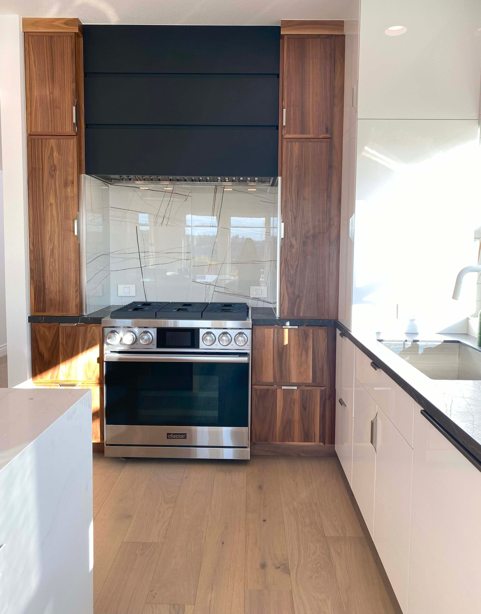 Omega-Walnut-cabinets-with-Natural-finish-door-style-Jax-with-white-interior-finish