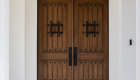 Urban-Doors-Dual-Entry-Doors-in-Knotty-Alder-with-Speakeasy-and-Decorative-Grill-Knocker