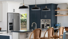 metal-and-natural-wood-kitchen-pendants-in-black-over-large-kitchen-island