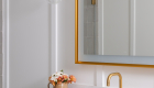 Sky-White-Dolomite-Honed-quartz-countertop-and-shower-curb-with-undermount-sink-and-Vitality-Sculpt-light-up-mirror