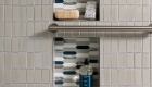 Decorative- Shower-Niche-Elysium-Glass-tiles-Newport-Series-in-Arrow-Beach-Finish-with-polished-nickel-schluter-trim