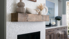 fireplace-refresh-in-ladera-ranch-with-reclaimed-wood-mantle-and-bronze-picture-light