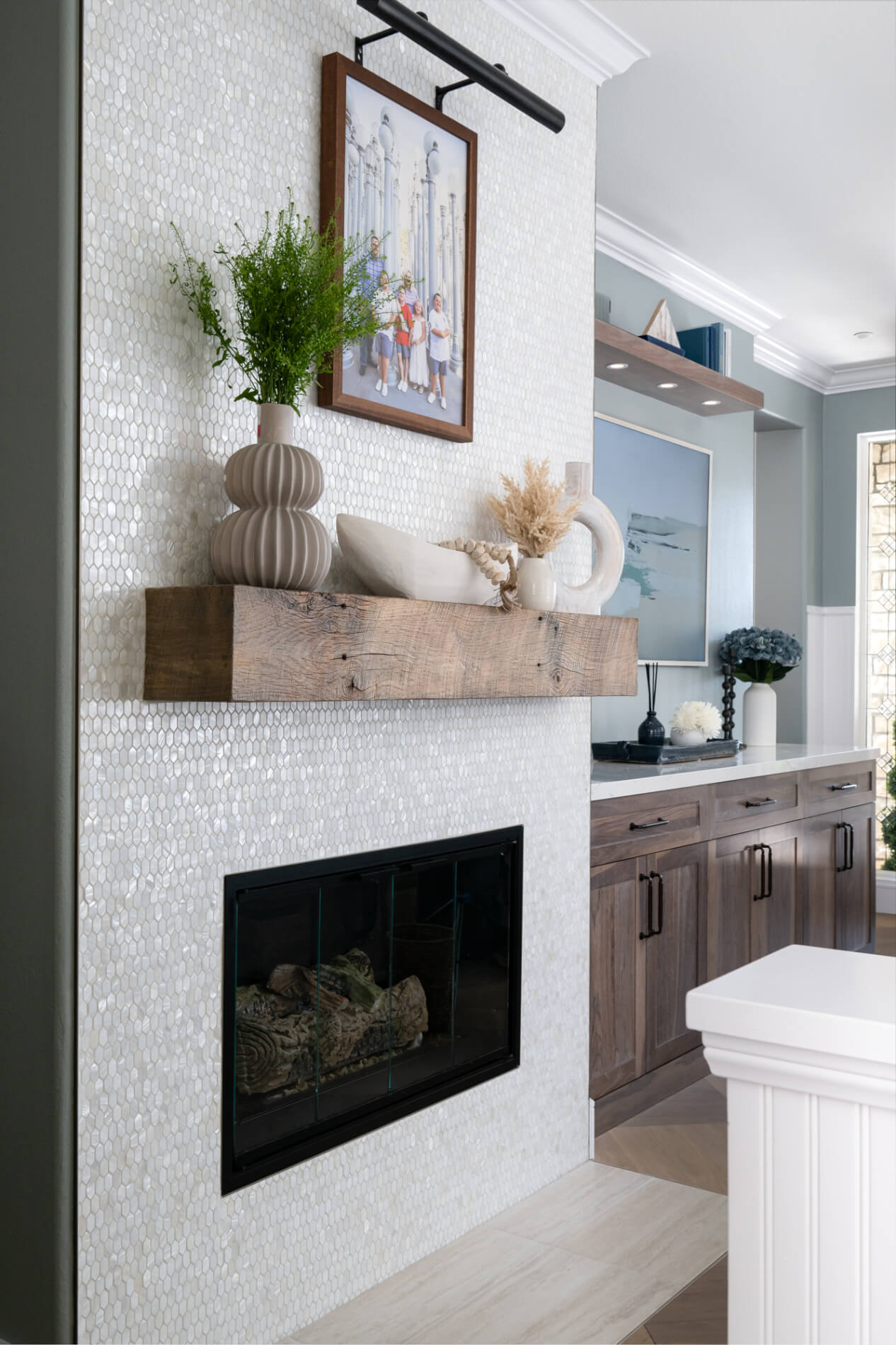 fireplace-refresh-in-ladera-ranch-with-reclaimed-wood-mantle-and-bronze-picture-light