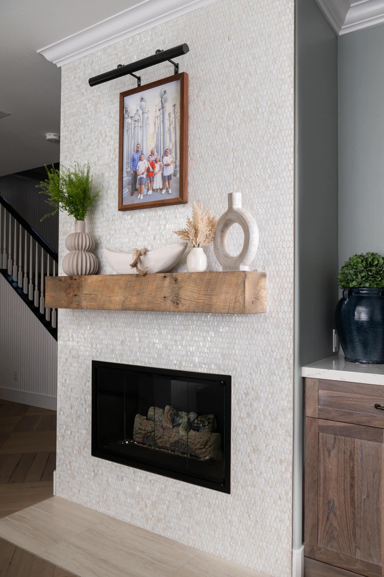 Fire-wall-tile-by-Elysium-in-natural-white-Mother-Of-Pearl-hexagon-tiles-with-Emser-porcelain-tile-hearth-in-color-Hall
