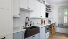 Lower-cabinets-painted-in-Benjamine-Moore-Blue-Heather-including-refrigerator-and-dishwasher-panels