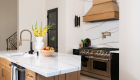 kitchen-island-includes-a-quartz-waterfall-edge