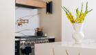 polished-quartz-countertop-and-backsplash-by-Silestone-in-Eterna-D'or