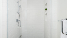 shower-wall-glazed-ceramic-subway-tiles-in-undulated-Santorini-including-2-niches