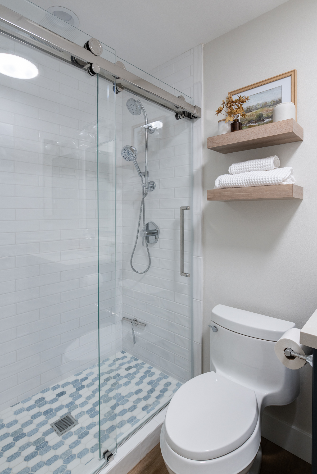 Emser-subway-white-glazed-ceramic-wall-tiles-and-Elysium-mosaic-elongated-hexagon-shaped-pan-tiles-in-Montage-Crystal-Ocean