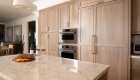 Paneled-Fridge-with-brushed-satin-nickel-pulls-integrated-into-the-cabinetry