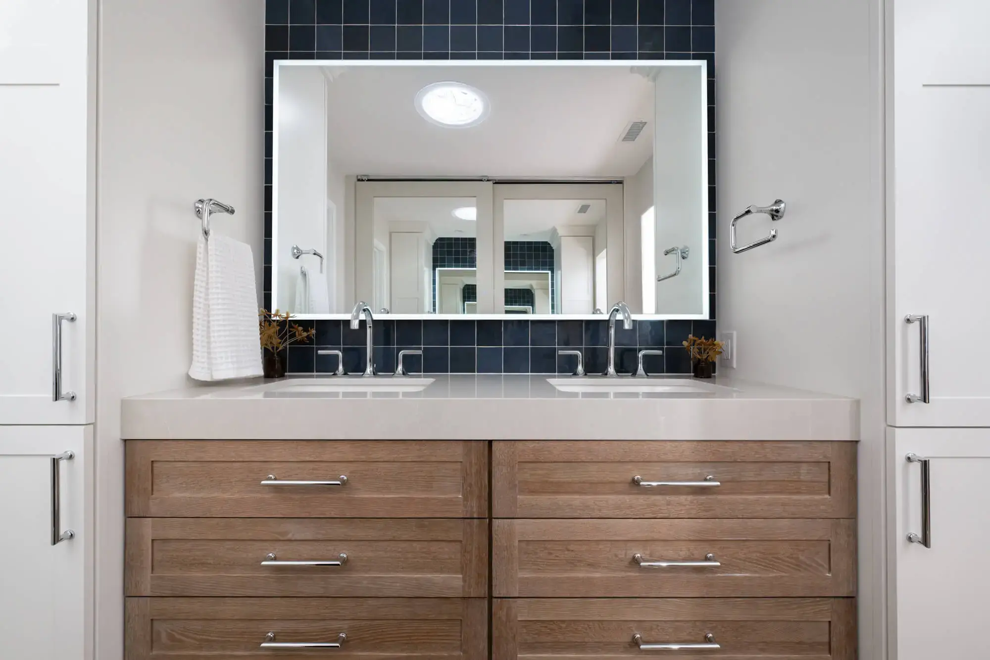 2025 bathroom remodeling trends include tile behind the vanity