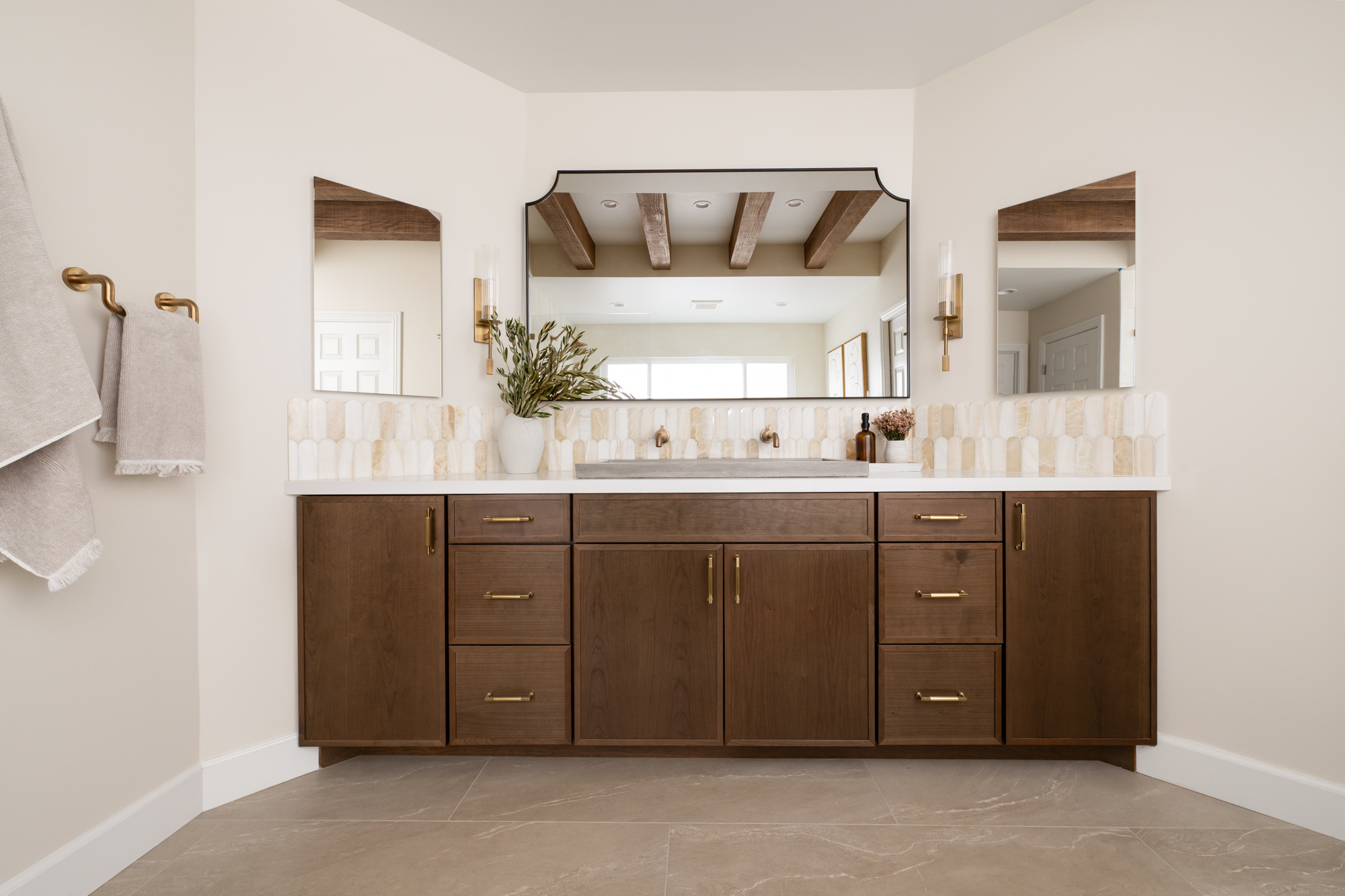 frameless-mirrored-medicine-cabinets-sit-on-each-side-of-oil-rubbed-bronze-metal-framed-double-vanity-mirror