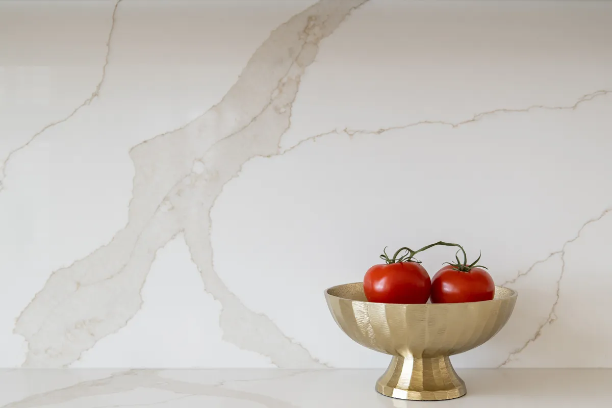 Sea-Pointe-Design-And-Remodel-Cappadocia-quartz-countertops-and-backsplash-by-Vadara-in-polished-Aurum-finish