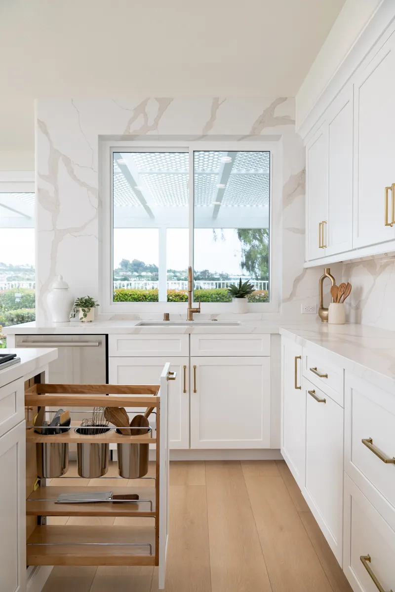 Sea-Pointe-Design-And-Remodel-Cappadocia-custom-cabinetry-with-pull-outs-on-opposite-side-of-island