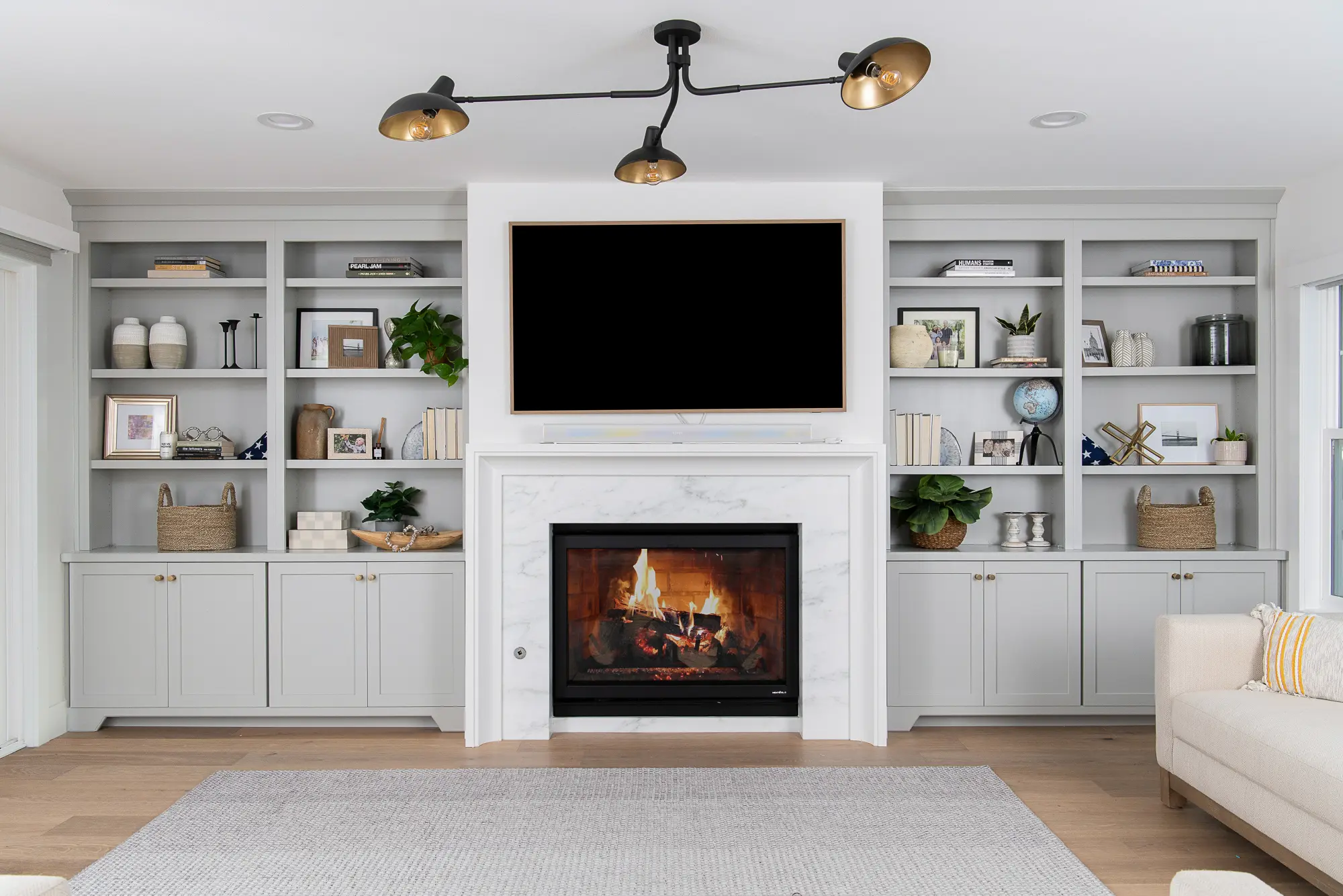 Marble fireplace surround and custom cabinets