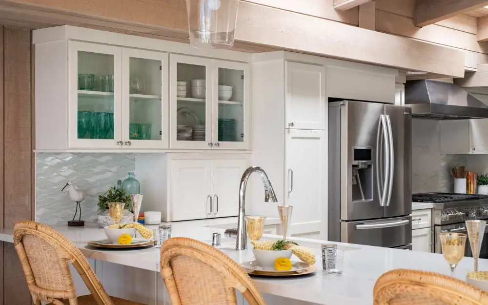 White cabinets with glass doors in San Clemente kitchen remodel