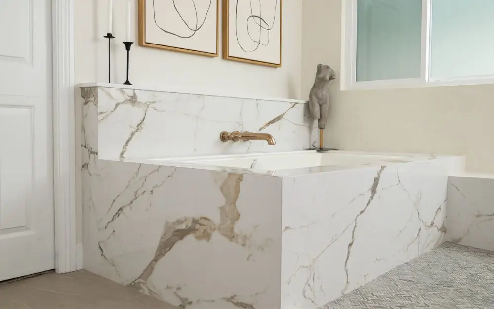 Drop-in-Rectangular-Tub-with-wall-mounted-faucet-surrounded-in-porcelain-tile-in-matte-Glossy-Origens