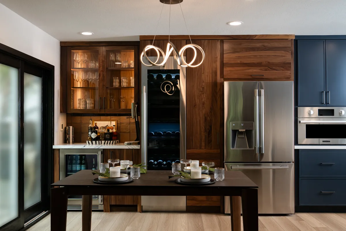 sea-pointe-design-and-remodel-bar-area-features-an-under-counter-ice-maker-with-wood-paneling-and-integrated-column-wine-refrigerator