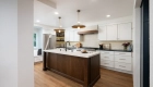 11-Sea-Pointe-Design-and-Remodel-island-Kemper-maple-shaker-cabinetry-in-Kanga-finish-and-honey-bronze-pulls