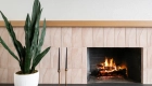 20-Sea-Pointe-Design-and-Remodel-trim-beam-mantle-in-natural-stained-wood-terrcottacharcoal-soapstone-hearth-topper