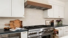 4-Sea-Pointe-Design-and-Remodel-custom-cabinetry-including-a-spice-rack-next-to-double-oven-range