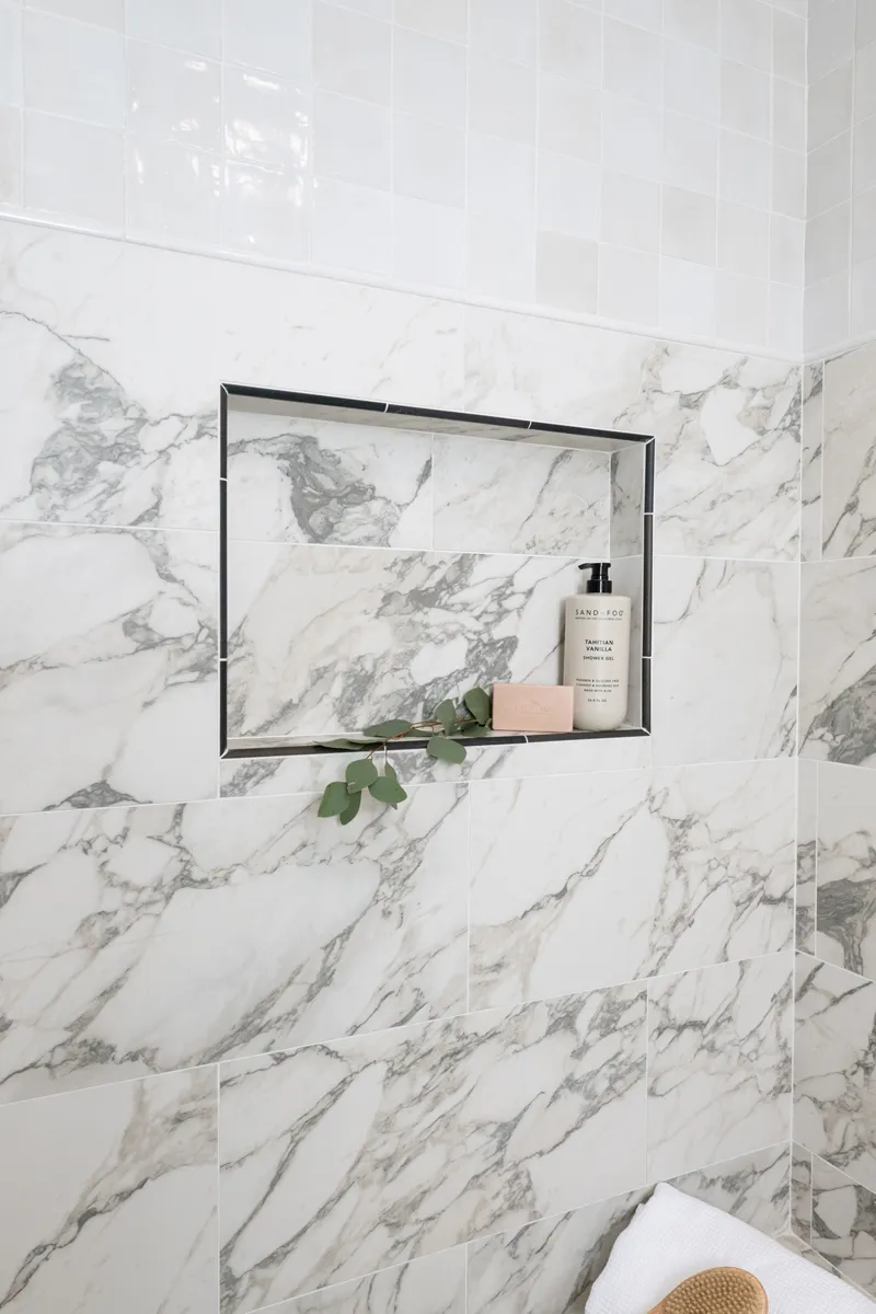 sea-pointe-design-and-remodel-shower-flooring-and-upper-accents-in-Bedrosians-Celine-series-in-white-4-inch-square-porcelain-tiles