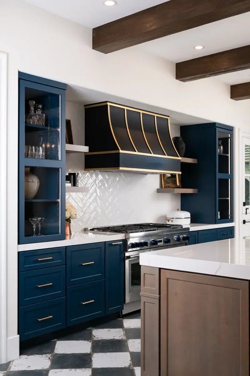 Sea-Pointe-Design-and-Remodel-black-sloped-hood-with-brass-straps
