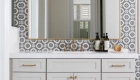 Sea-Pointe-Design-And-Remodel-thin-aged-brass-metal-framed-mirrors-sit-above-the-vanities