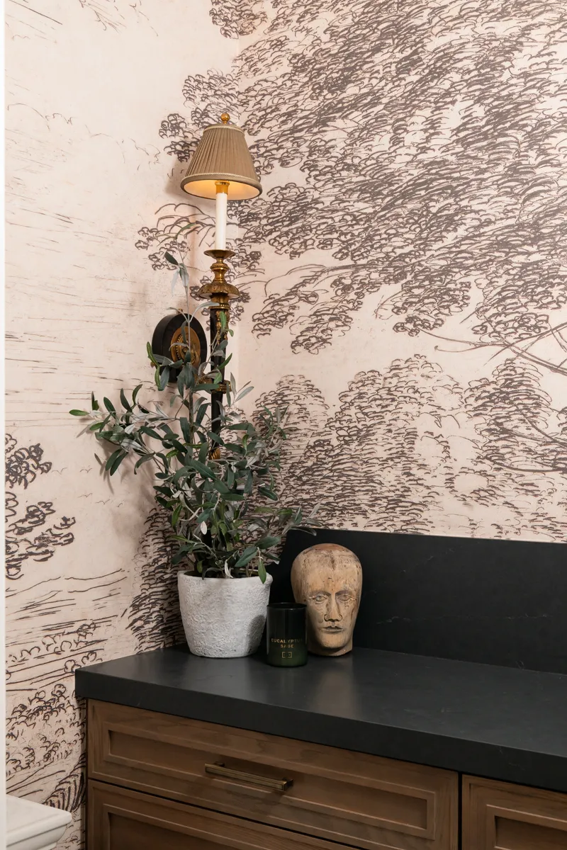 Sea-Pointe-Design-And-Remodel-Omega-framed-cabinetry-in-chinchilla-finish-with-quartz-countertops-in-Charcoal-soapstone-with-a-sued-finish-and-decorative-backsplash