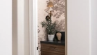 Sea-Pointe-Design-And-Remodel-toile-style-design-wallpaper-in-sepia-tone-with-foliage-Kaleidoscope-Block-Calacatta-with-Tulip-Black-marble-mosaic-flooring