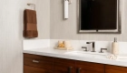 Sea-Pointe-Design-And-Remodel-single-white-undermount-sink-with-Luxe-nickel-widespread-bathroom-faucet