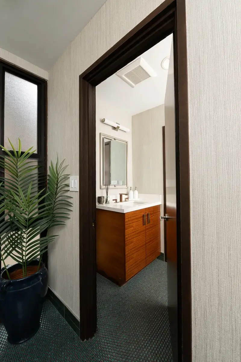 Sea-Pointe-Design-And-Remodel-powder-bath-remodel-with-double-framed-rectangular-mirror-in-brushed-nickel